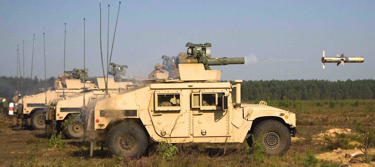Army Humvees armed with TOW missiles during training. <em>US Army</em>
