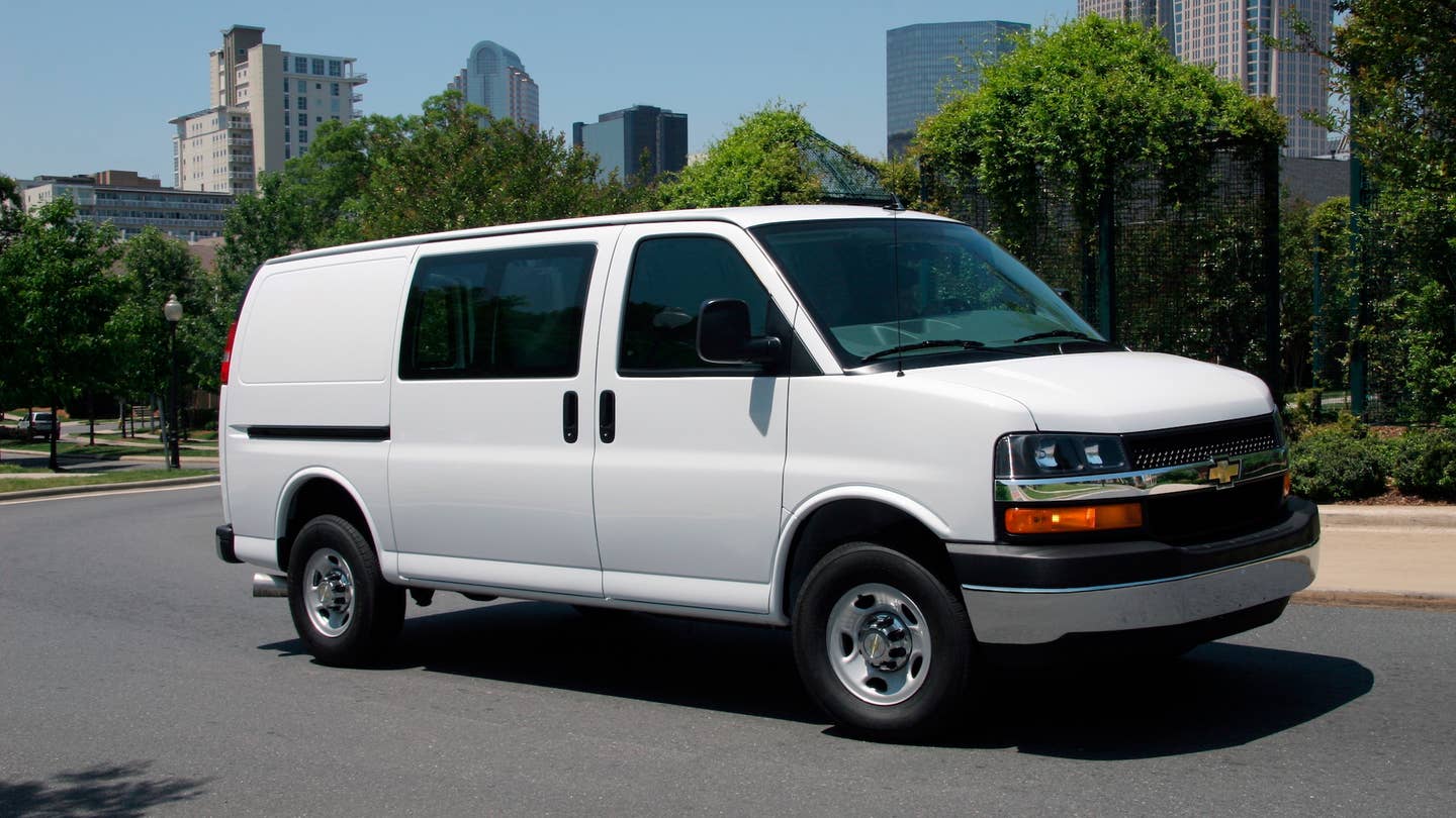 Front 3/4 of a white Chevy Express van.
