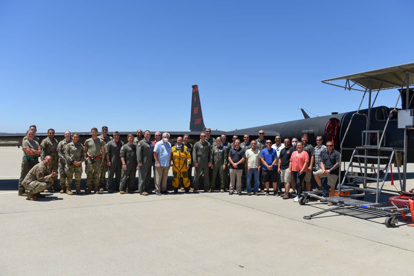 Members of the 9th Intelligence Squadron, Collins Aerospace, and the 1st Training Squadron gather for the Optical Bar Camera's final flight out of the 9th Reconnaissance Wing June 24, 2022 at Beale Air Force Base, California. (U.S. Air Force photo by 2nd Lt. Hailey M. Toledo)&nbsp;