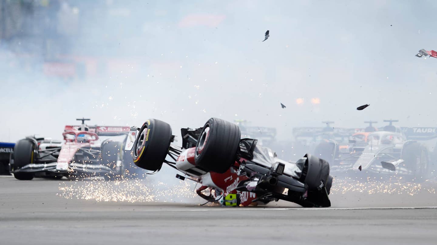 Zhou Guanyu of China Alfa Romeo F1 and George Russell of Great Britain and AMG Petronas F1 crash their cars during the race of the F1 Grand Prix of Great Britain at Silverstone on July 3, 2022 in Northampton, United Kingdom. (Photo by Jose Breton/Pics Action/NurPhoto via Getty Images)