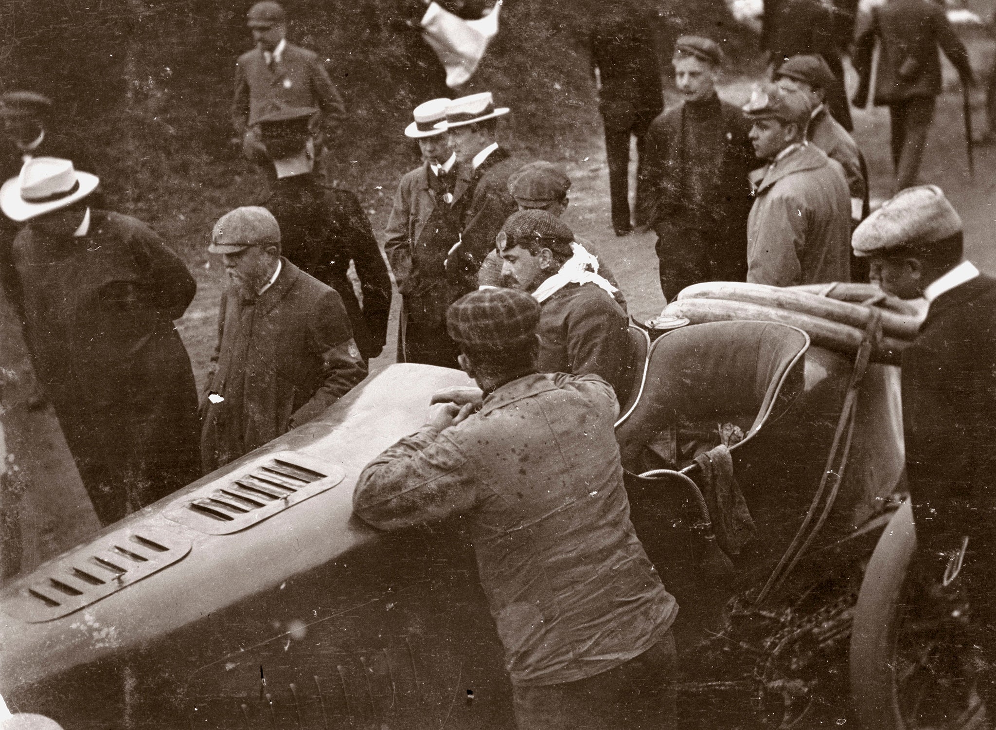 IRELAND - NOVEMBER 29:  Photograph taken from an album of images compiled by English motor car manufacturer and aviator Charles Stewart Rolls (1877-1910), showing Gabriel in his Mors Z surrounded by spectators. The prestigious Gordon Bennett Trophy race was first held in 1900. As the 1902 race had been won for Britain by S F Edge, the British had the honour of hosting the 1903 event, staging it at a circuit at Athy, in Ireland. The race was won for Germany by Camille Jenatzy, driving a Mercedes, Gabriel finishing fourth for France. Rolls was a well known competitor on the motor racing circuit at the time. He failed to gain selection for the 1903 Gordon Bennett race, coming second in an elimination heat held on the Duke of Portland�s estate at Welbeck, Nottinghamshire.  (Photo by SSPL/Getty Images)
