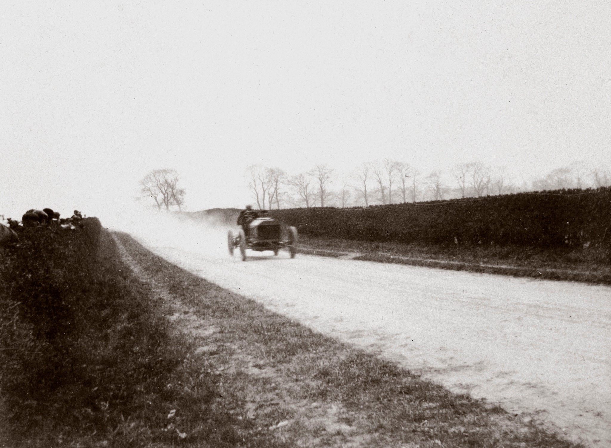UNITED KINGDOM - DECEMBER 04:  Photograph taken from an album of images compiled by English motor car manufacturer and aviator Charles Stewart Rolls (1877-1910). It shows Rolls competing in the elimination trial for the prestigious Gordon Bennett Trophy race, which was to be held at Athy in Ireland in 1903. The elimination trial, to select the final driver for the British team was held on the Duke of Portland�s estate at Welbeck, Nottinghamshire. Driving his Napier Racer, Rolls, who was well known on the motor racing circuit, finished second, thus failing to gain selection. Napier was the first British manufacturer to produce cars specifically for motor racing, and they were the first cars to compete painted in the famous British Racing Green colour.  (Photo by SSPL/Getty Images)