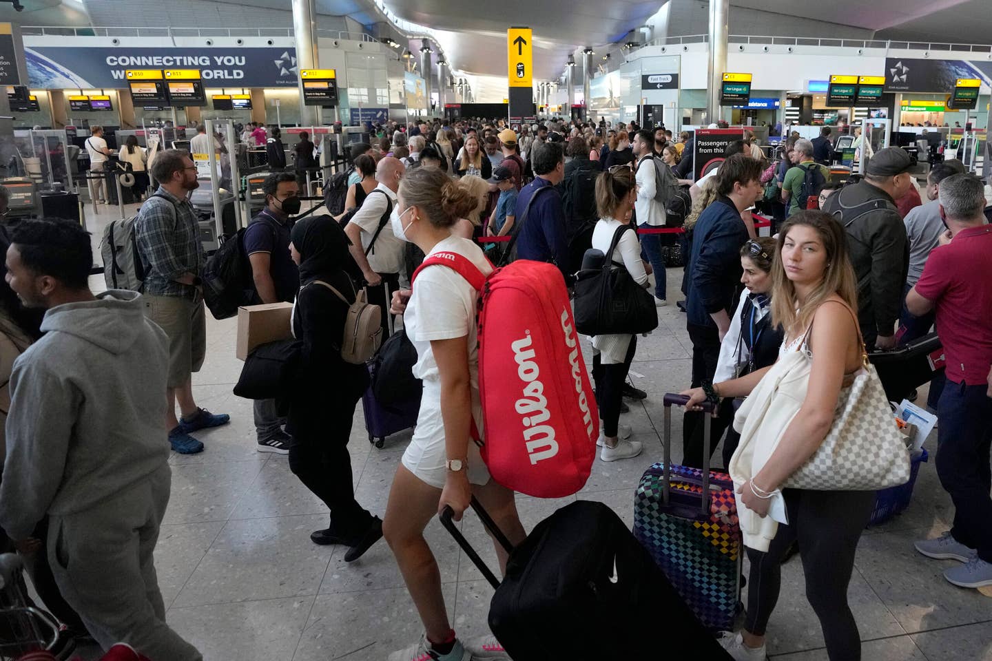 Travelers have been looking more miserable than usual as staff shortages cause increased delays and cancellations.