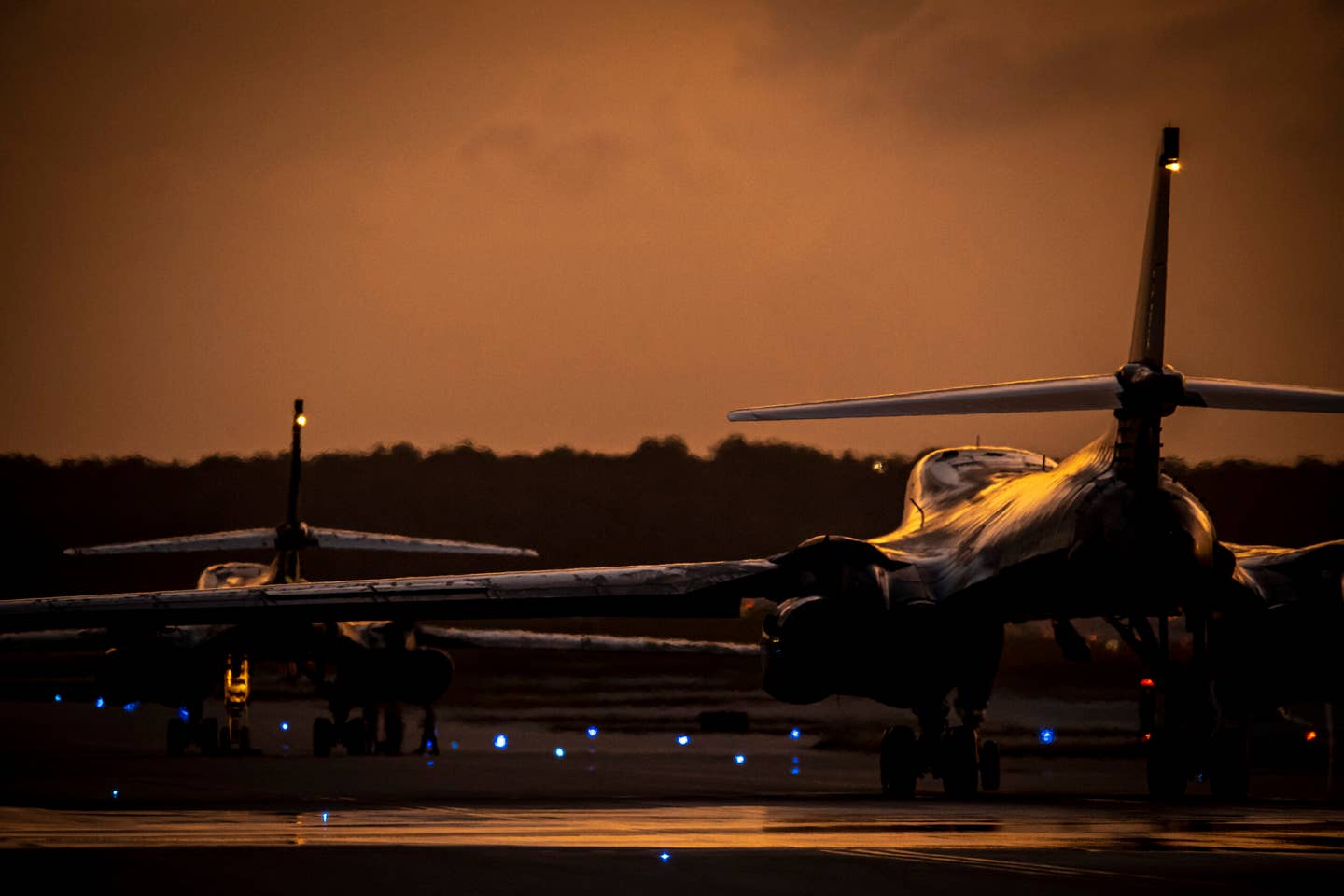 Two Lancers taxi after receiving a fresh water rinse at Anderson Air Force Base, June 8, 2022. <em>U.S. Air Force photo by Tech. Sgt. Chris Hibben</em>
