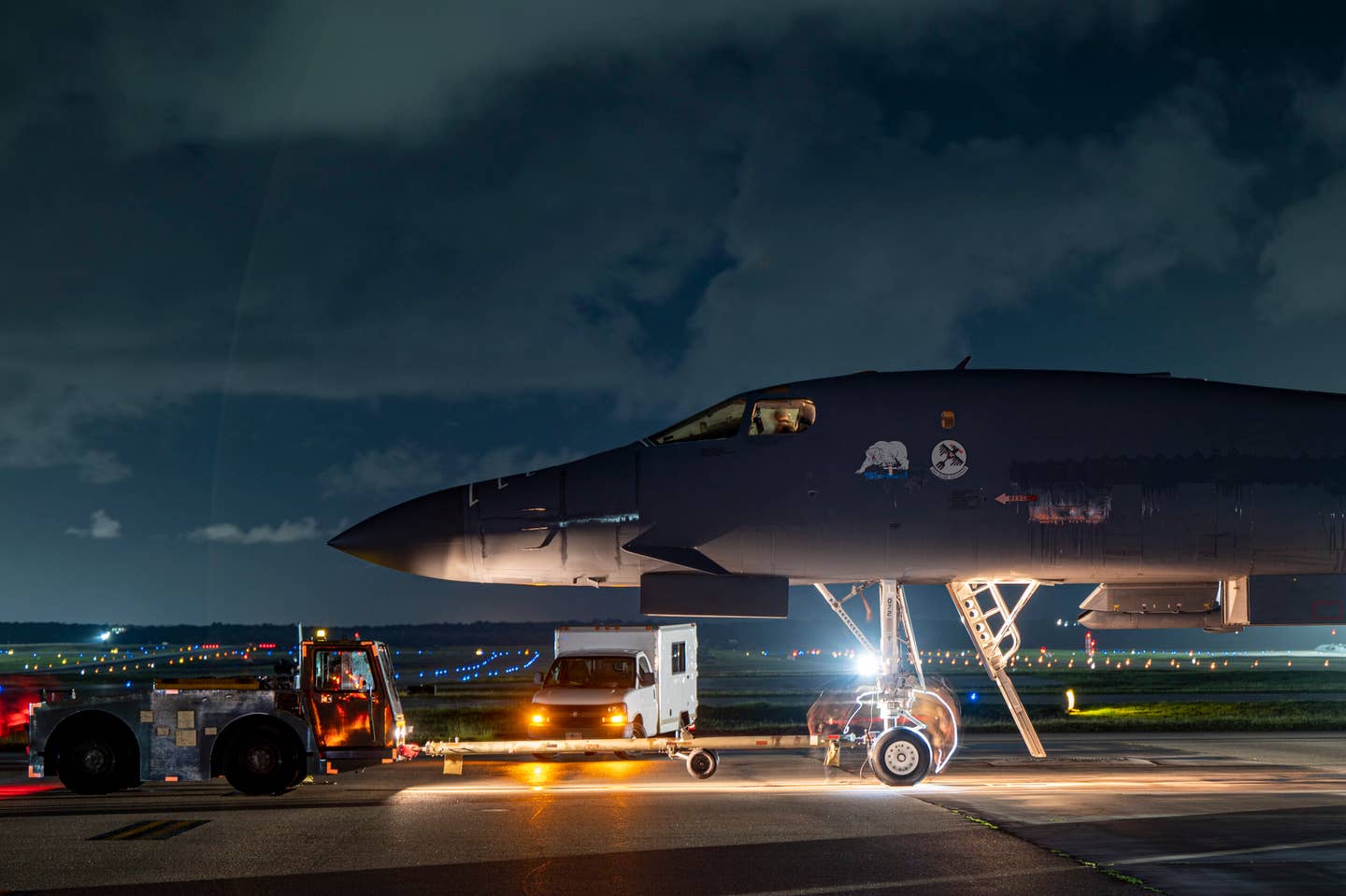 ​​B-1B maintainers assigned to the 34th Aircraft Maintenance Squadron push a Lancer to a parking spot after returning to Andersen Air Force Base, June 22, 2022. <em>U.S. Air Force photo by Master Sgt. Nicholas Priest</em>