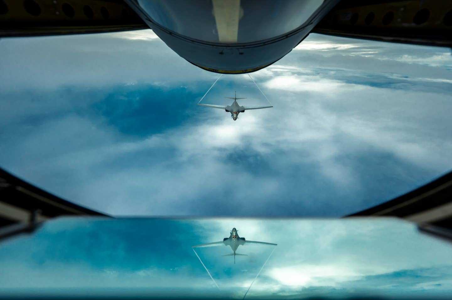 A B-1B flies behind a U.S. Air Force KC-135 Stratotanker, assigned to 506th Expeditionary Air Refueling Squadron, during a Bomber Task Force mission over the Pacific Ocean, June 25, 2022. <em>U.S. Air Force photo by Master Sgt. Nicholas Priest</em>