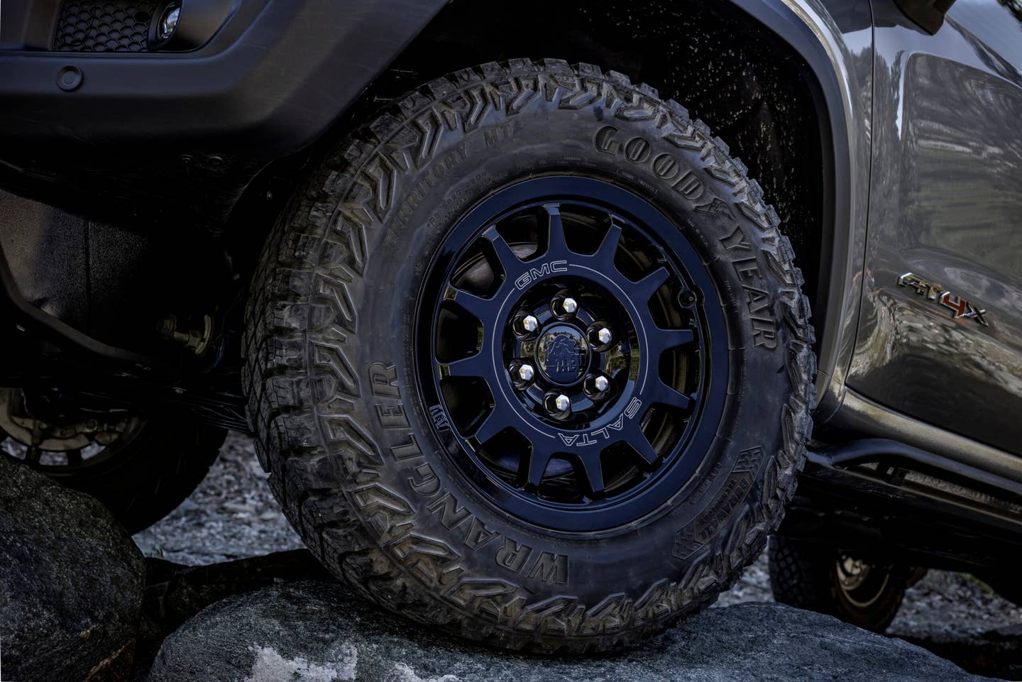 The 2023 GMC Sierra 1500 AT4X AEV Edition tackles off-road obstacles. The AEV Edition features 18-inch AEV Salta wheels with recessed valves for added protection on the trail and 33-inch Goodyear Wrangler Territory MT tires.