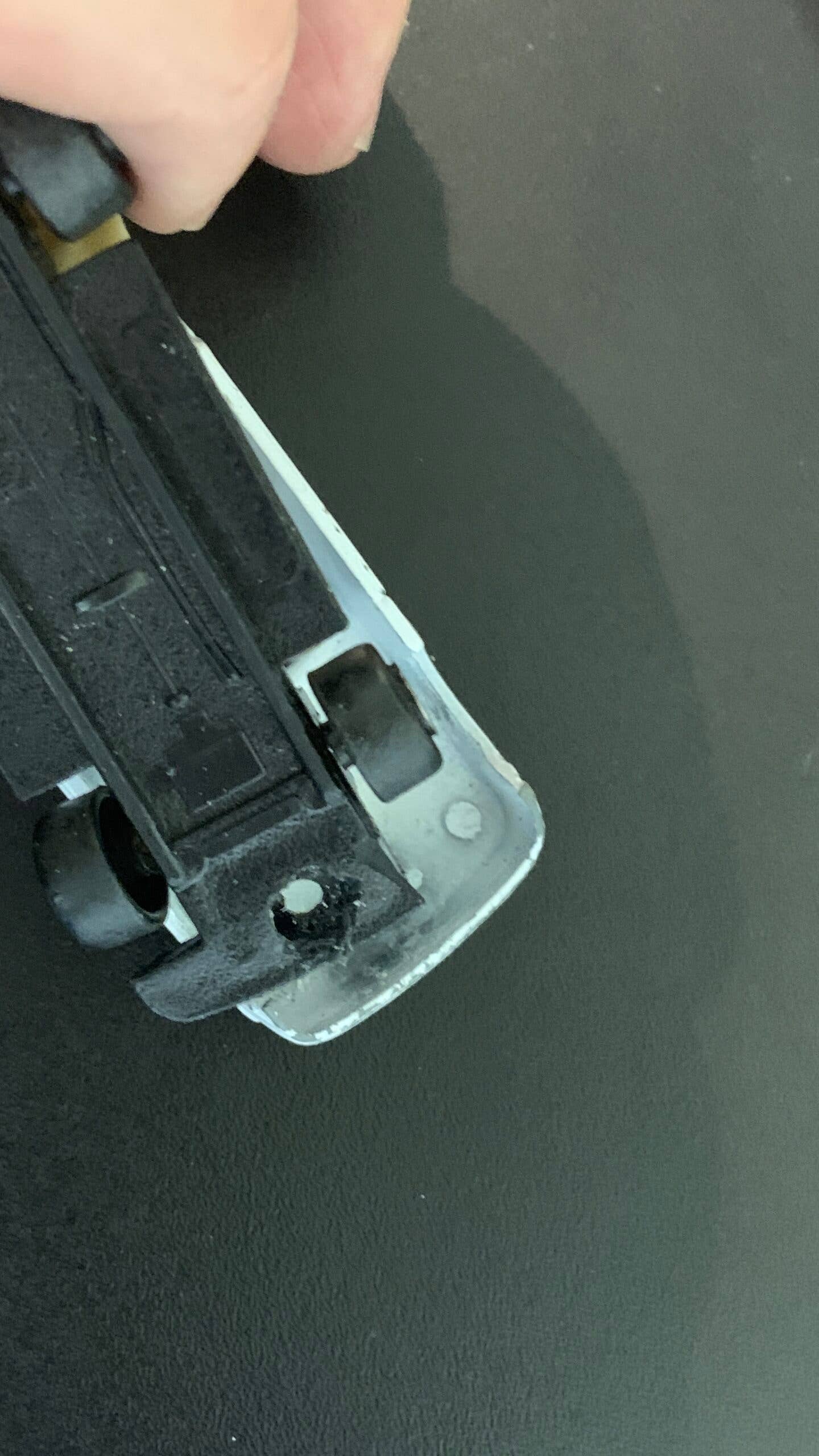 1:64-scale car rivet removal.