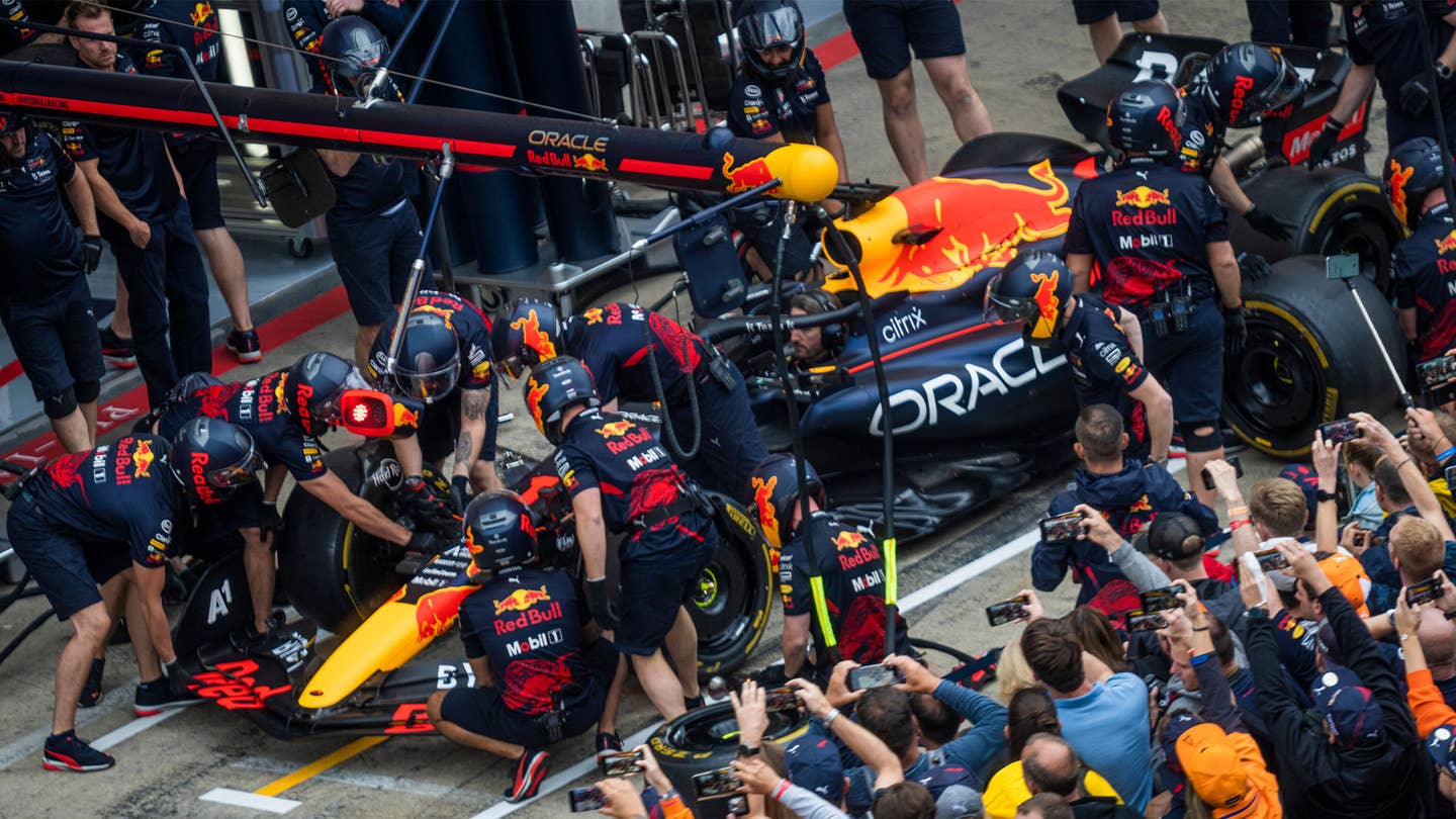 the Red Bull team practicing a pit stop ahead of the Austrian Grand Prix