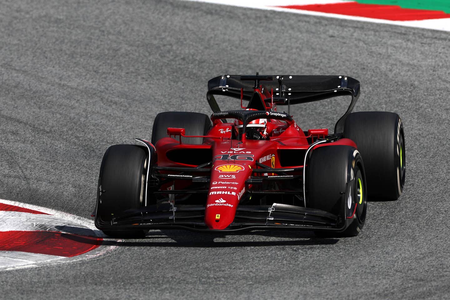 Charles Leclerc leading in the final laps of the Austrian GP | (Photo by Bryn Lennon/Getty Images)