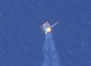 A Russian-occupied Black Sea gas rig, hit by Ukraine forces on June 20, is still burning. <em>PHOTO © 2022 PLANET LABS INC. ALL RIGHTS RESERVED. REPRINTED BY PERMISSION</em>
