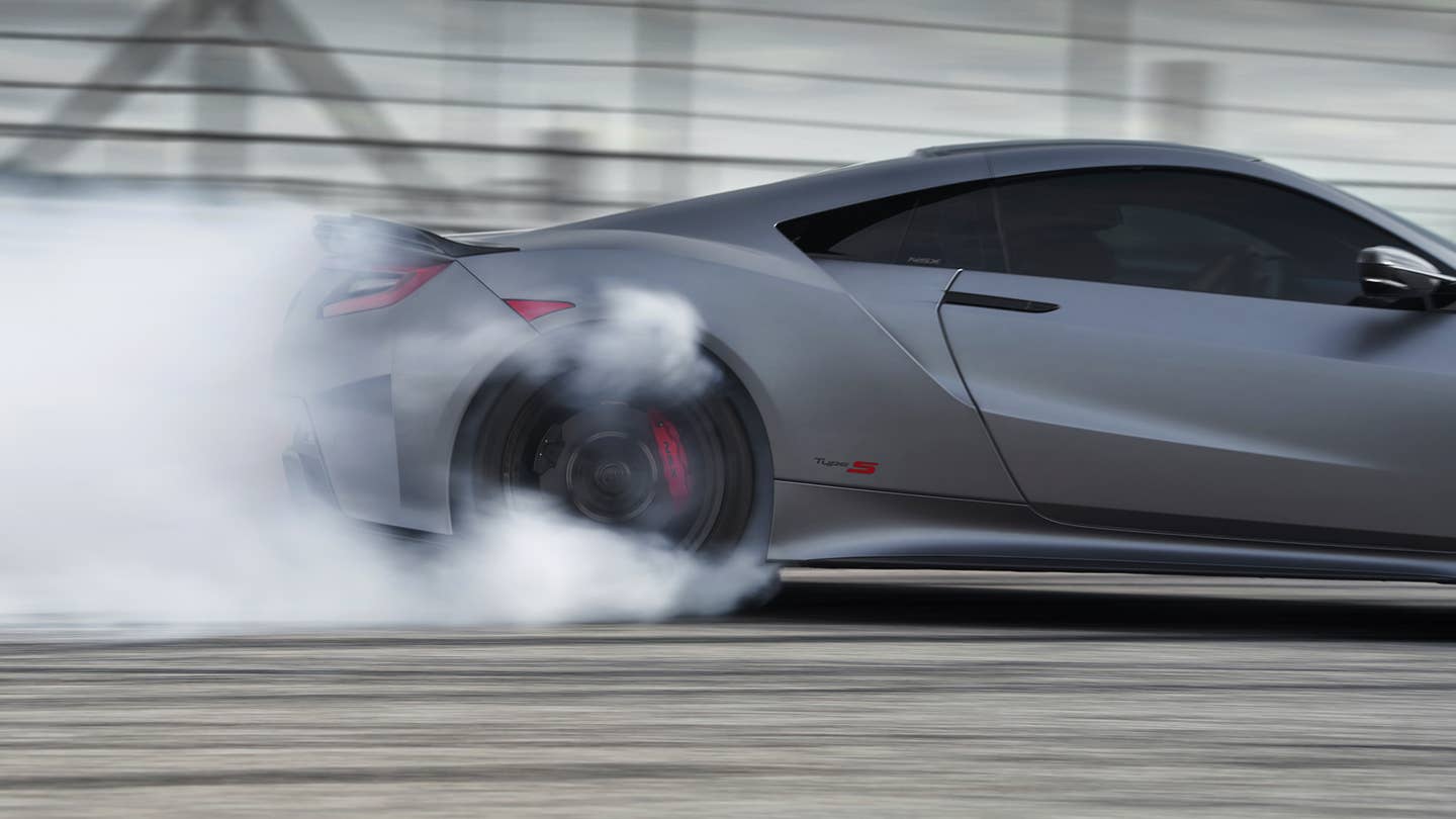 An Acura NSX Type S lighting up its tires.