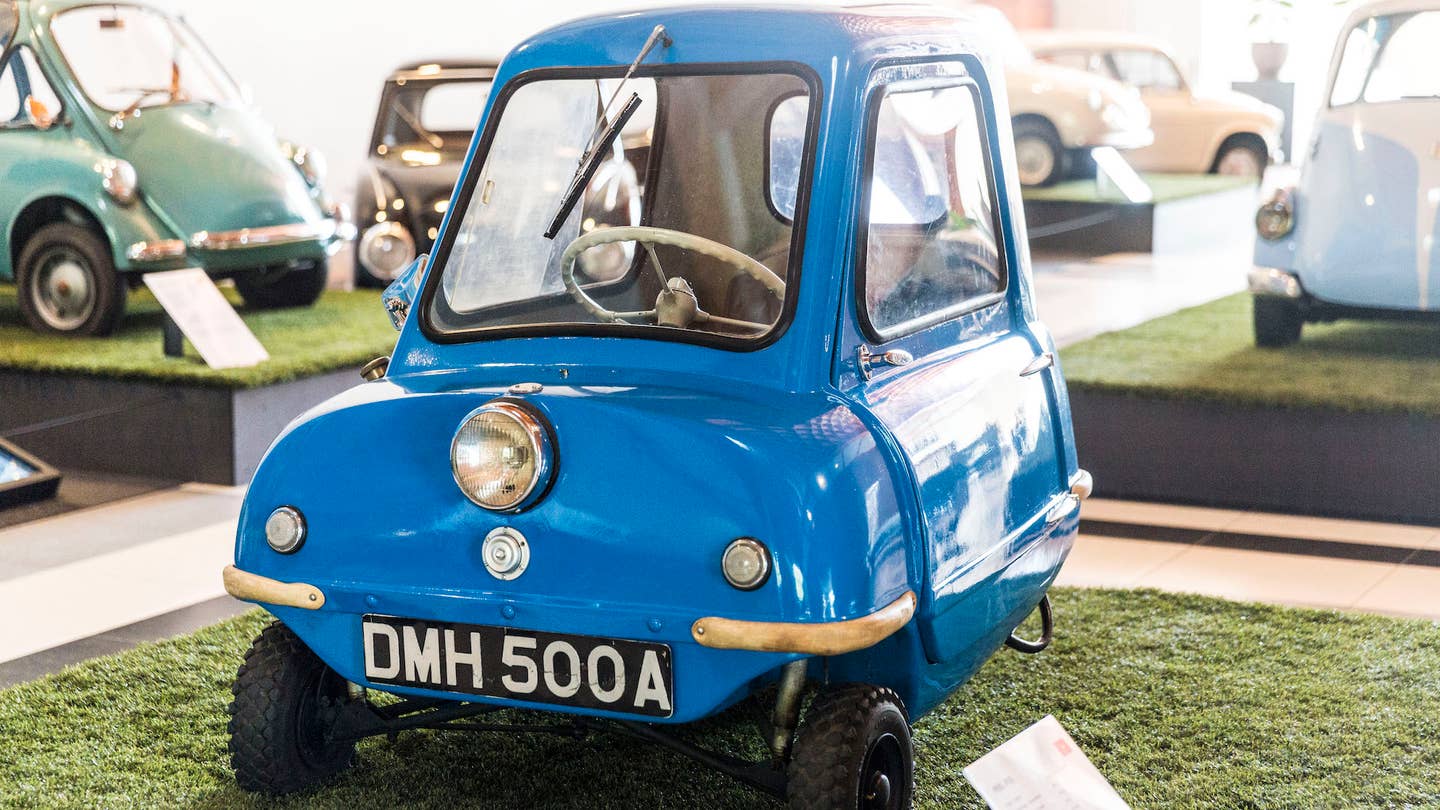 THE HAGUE, NETHERLANDS - JULY 5: A 1962 Peel P50, the smallest microcar ever manufactured, stands at the microcar exhibition at the Louwman Museum on July 5, 2019 in The Hague, The Netherlands.  Built on the Isle of Man, it is just 132 cm long, 99 cm wide and weighs just 59 kilos. Microcars are light-weight miniature vehicles, usually powered by a motorcycle engine. They offered a cheap means of transport in post-war Europe and were popular until the early 1960s by which time the European motor industry had recovered. Today they are highly sought-after and have reached cult status. (Photo by Michel Porro/Getty Images) *** Local Caption ***