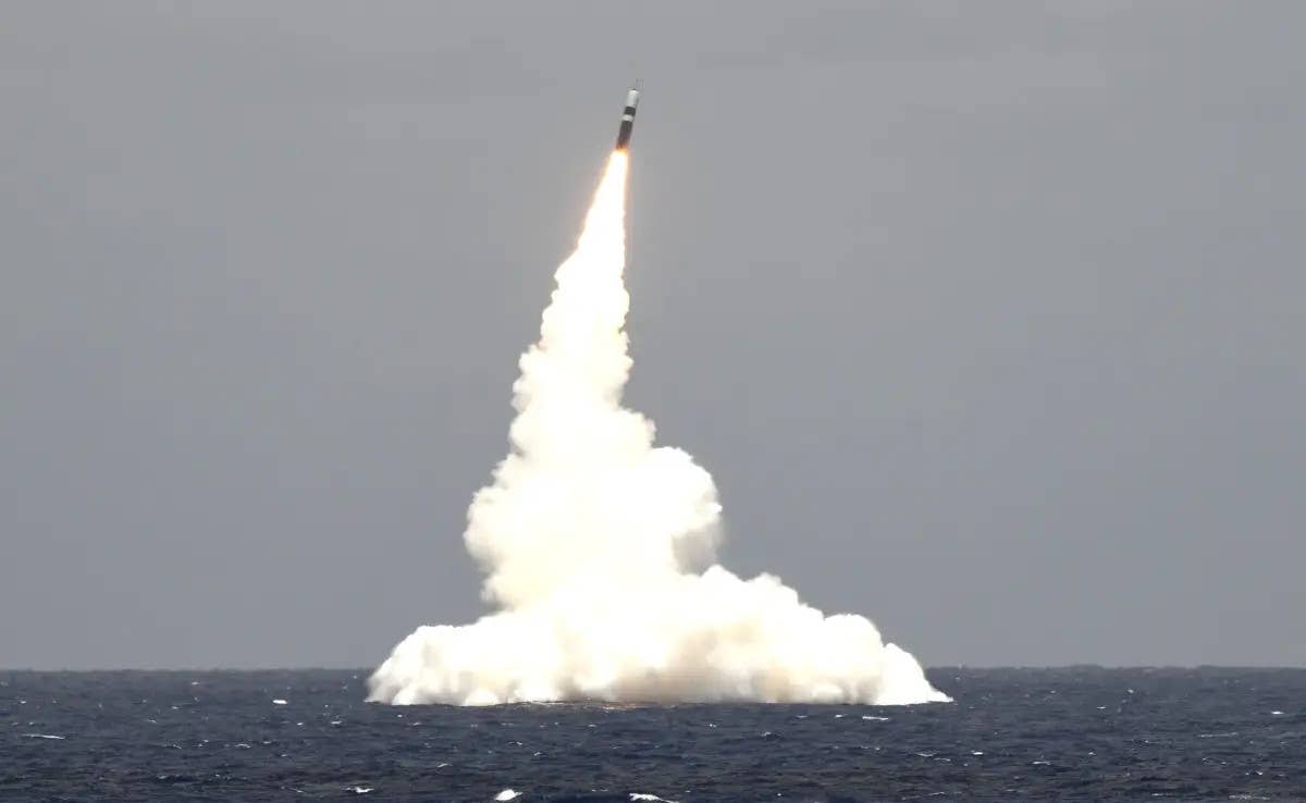 An unarmed Trident II/D5 submarine-launched ballistic missile shortly after being fired from the <em>Ohio</em> class ballistic missile submarine USS <em>Rhode Island</em> during a test in 2019. <em>USN</em>
