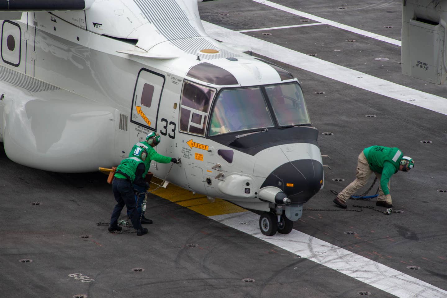 220429-N-TL932-1098 PACIFIC OCEAN (Apr. 29, 2022) Sailors prepare a CMV-22B Osprey, assigned to the “Titans” of Fleet Logistics Multi-Mission Squadron (VRM) 30, for flight on the flight deck of Nimitz-class aircraft carrier USS Carl Vinson (CVN 70), April 29. Vinson is currently underway conducting routine maritime operations in the Pacific Ocean. (U.S. Navy photo by Mass Communication Specialist Seaman Joshua Sapien)