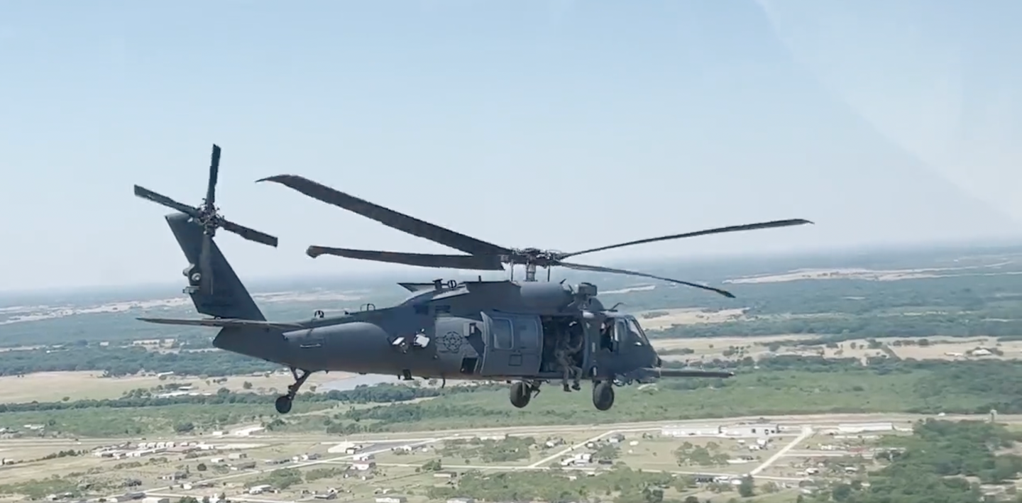The HH-60W helicopter during air combat maneuver training in Texas. <em>Department of Defense.</em>