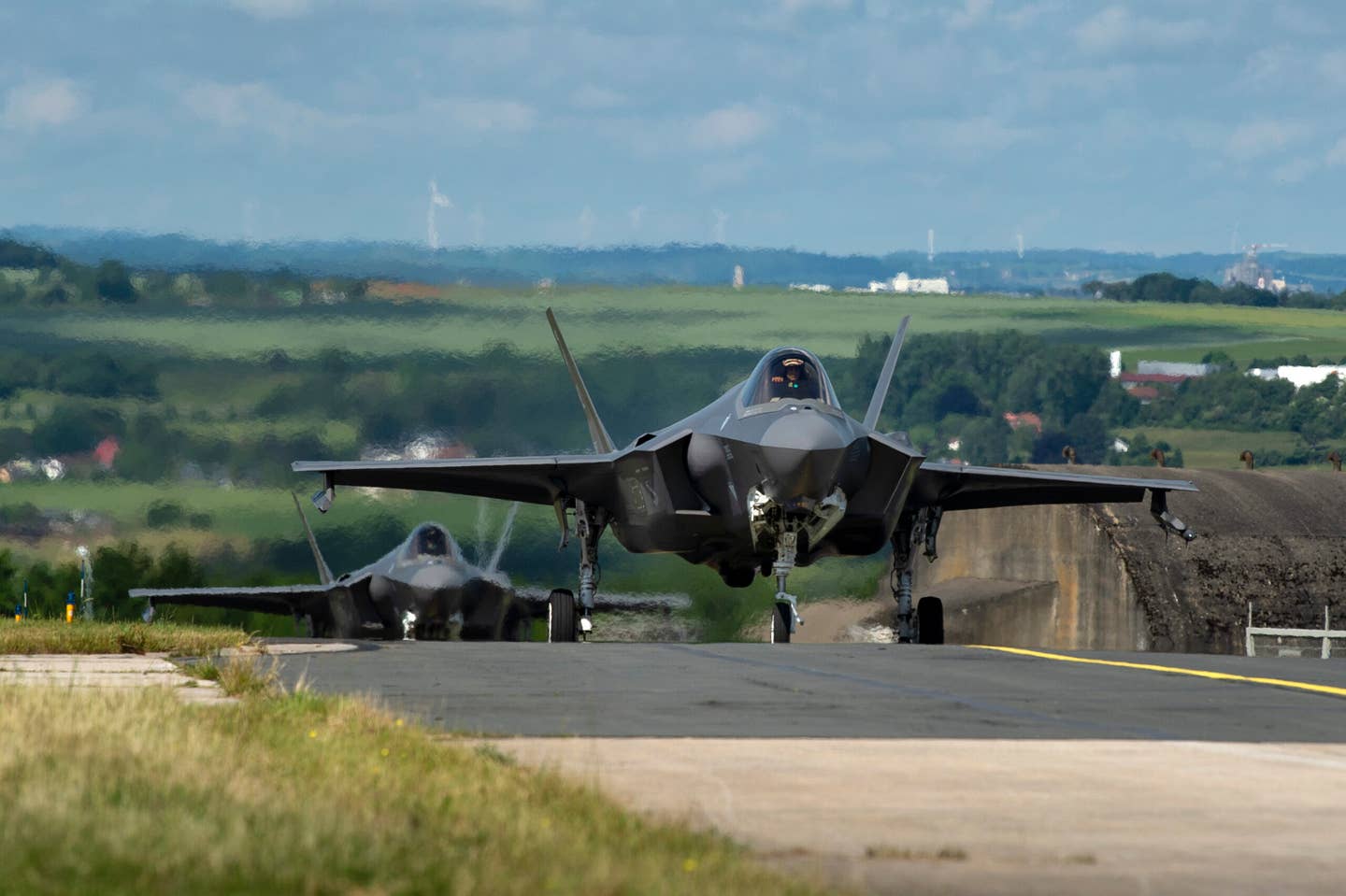 U.S. Air Force F-35As, assigned to the 421st Fighter Squadron, Hill Air Force Base, Utah, taxi on the flight line at Spangdahlem Air Base, Germany, in June 2019. <em>U.S. Air Force photo by Airman 1st Class Valerie Seelye</em>