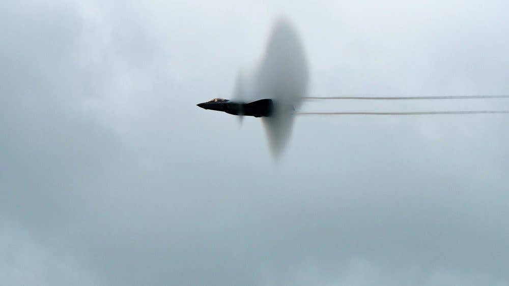 An F-35A Lightning II aircraft assigned to the Air Force’s F-35 Demo Team creates a vapor cone as it performs a demonstration flight at Tinker Air Force Base, Oklahoma, May 25, 2021. (U.S. Air Force photo by Mark Hybers)