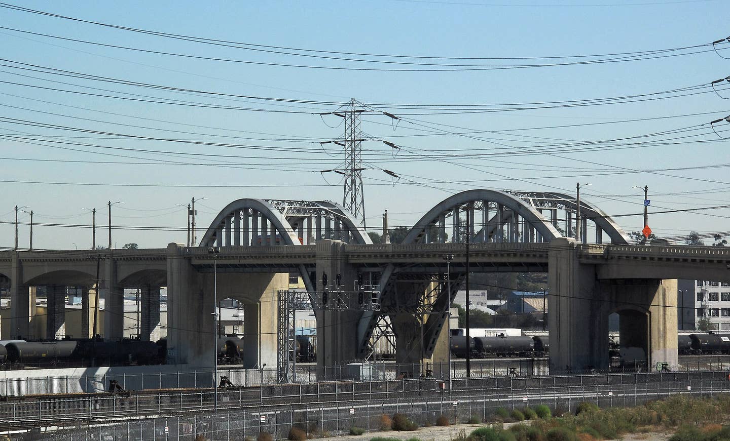 The original Sixth Street Viaduct, pictured shortly before its demolition in 2016. <em><a href="https://en.wikipedia.org/wiki/Sixth_Street_Viaduct#/media/File:Sixth_Street_Bridge_over_Los_Angeles_River.jpg">Downtowngal</a>, CC-BY-SA-3.0</em>