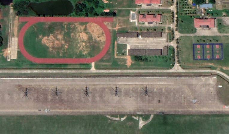 Mi-8/Mi-17-type helicopters, as well as J-7 fighter jets, at Longtian in 2019. <em>Google Earth</em>