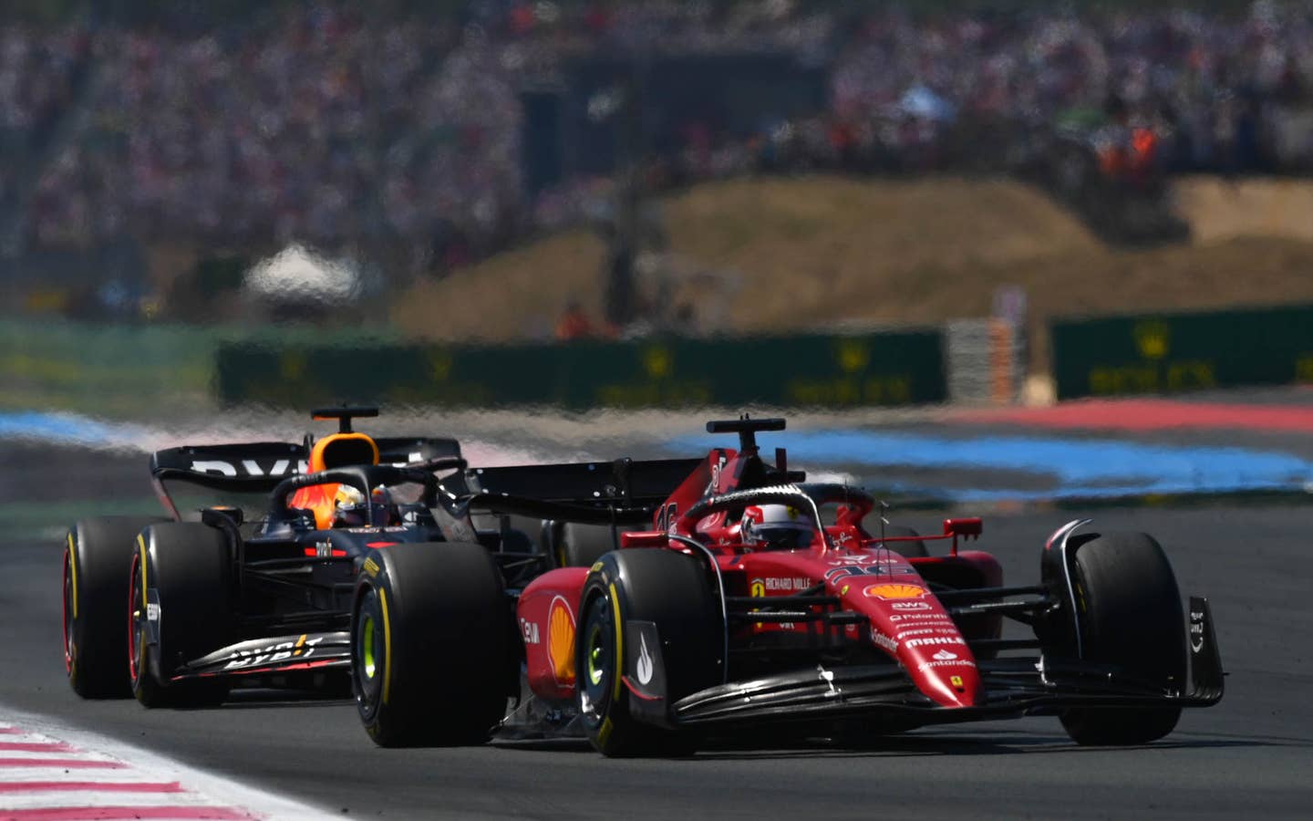 Charles Leclerc leads Max Verstappen during the early laps of the French GP | (Photo by Dan Mullan/Getty Images)