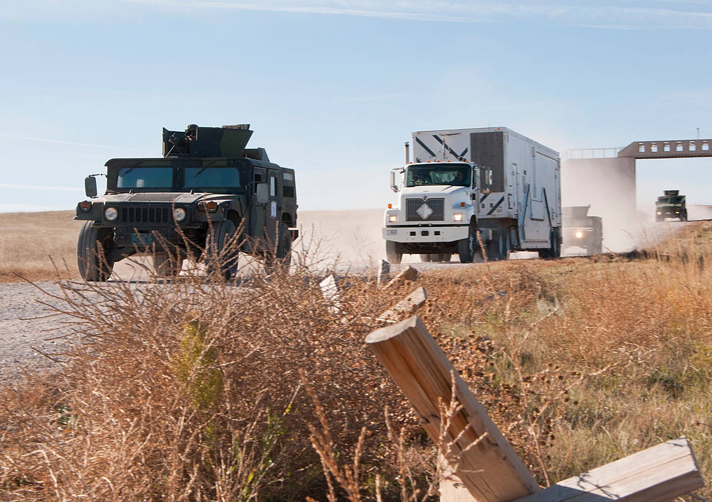 A convoy of 741st Missile Security Forces Squadron vehicles from Malmstrom Air Force Base, Montana, rolls down a dirt road during a training exercise in 2014. <em>U.S. Air Force photo by Senior Airman Jason Wiese</em>