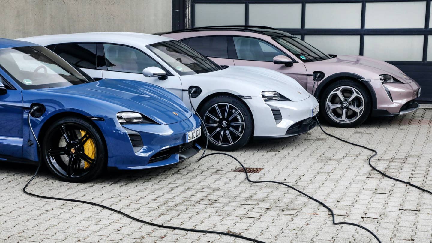 A trio of Porsche Taycans are charging side-by-side.