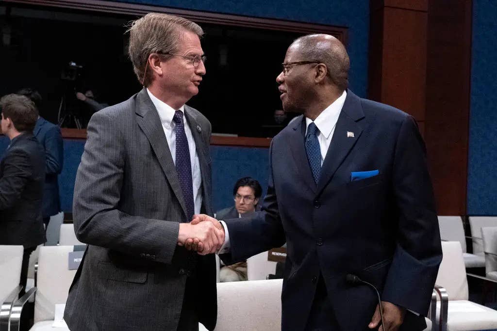 Rep. Tim Burchett, a Tennesee Republican, at left, shakes hands with Under Secretary of Defense for Intelligence and Security Ronald Moultrie, after a House Counterterrorism, Counterintelligence, and Counterproliferation Subcommittee, hearing on Unidentified Aerial Phenomena on May 17, 2022. <em>Jose Luis Magana / AFP via Getty Images</em>
