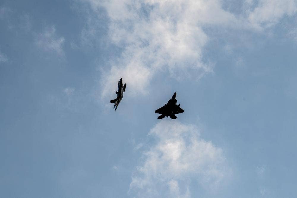 F-22 Raptors assigned to the 90th Fighter Squadron, 3rd Wing, Joint Base Elmendorf-Richardson, Alaska fly over the airfield at Royal Air Force Lakenheath, England, July 26. (U.S. Air Force photo by Airman Seleena Muhammad-Ali)