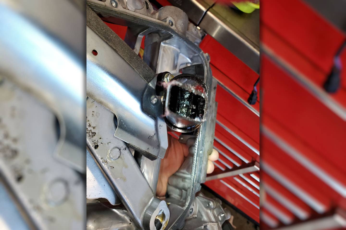 A photo of Alvarado's oil pickup after his engine failed. The gray material in the center of the pickup tube is RTV, while bearing material can be seen on the right side of the tube. <em>Blake Alvarado</em>