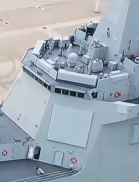 The front left-side fixed-face antenna associated with <em>Nanchang</em>'s Type 364B Dragon Eye radar is seen here on the side of the main superstructure under the bridge. To the right can be seen a small portion of another rectangular fixed-face antenna under the left-side bridge wing that is understood to be part of the ship's electronic support measures and electronic warfare suite. <em>Chinese Internet</em>