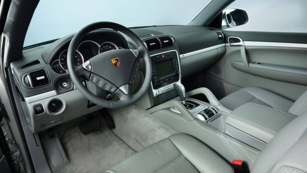 Inside, the convertible has a standard Cayenne interior, though the windscreen is shorter. <em>Porsche</em>