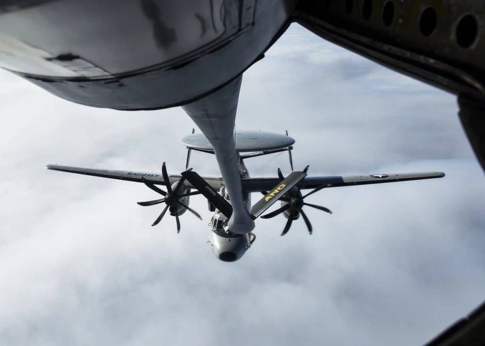 A U.S. Navy E-2D Advanced Hawkeye assigned to Airborne Command and Control Squadron (VAW) 126 Seahawks, receives fuel from a U.S. Air Force KC-135 Stratotanker assigned to the 171st Air Refueling Wing, Pennsylvania Air National Guard, on Feb. 4, 2021, near the East Coast. (U.S. Air National Guard photo by Senior Airman Zoe M. Wockenfuss)