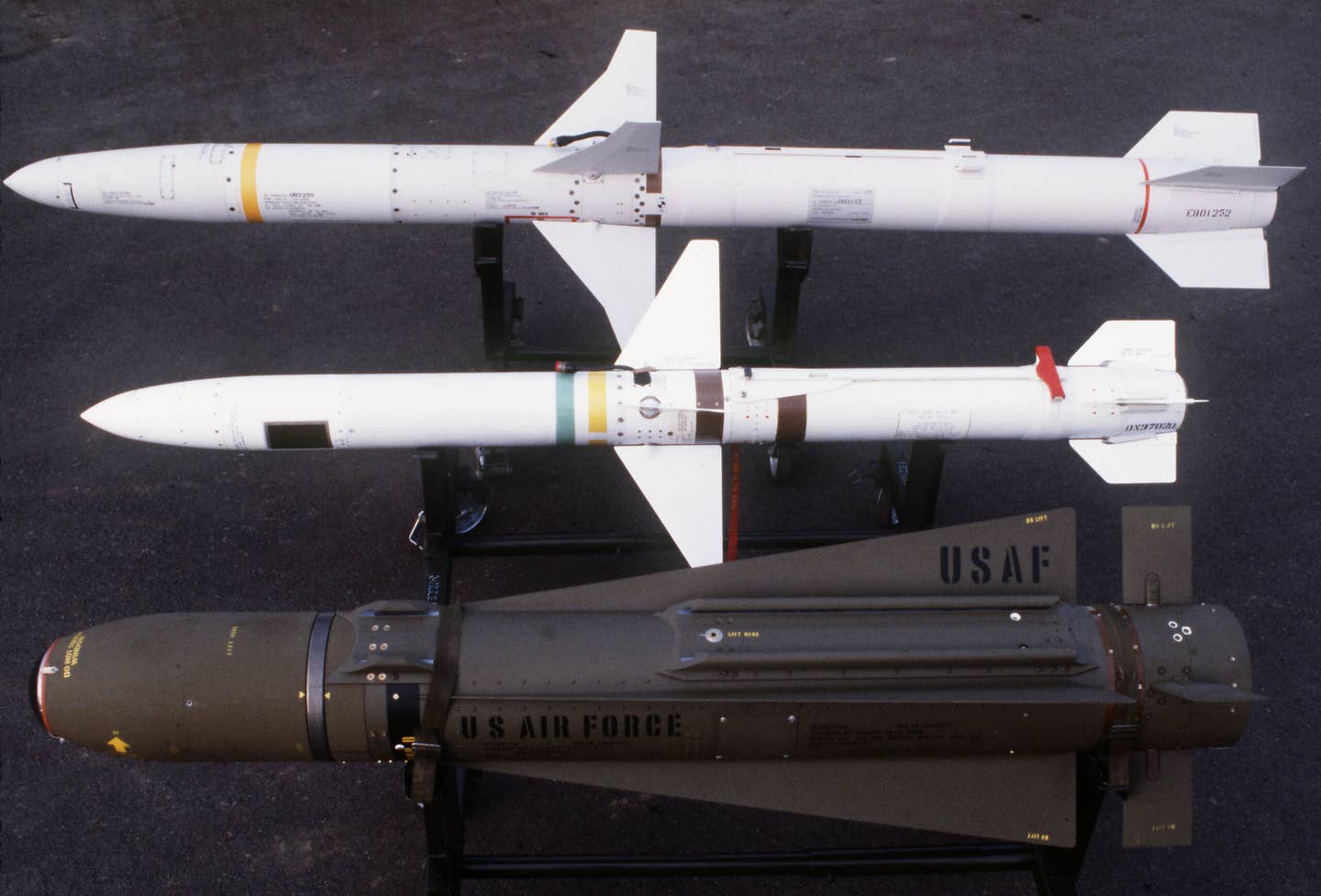 A view of, from top to bottom, an AGM-88 HARM high-speed anti-radiation missile, an AGM-45 Shrike anti-radiation missile, and an AGM-65 Maverick television-guided missile. (USAF image)