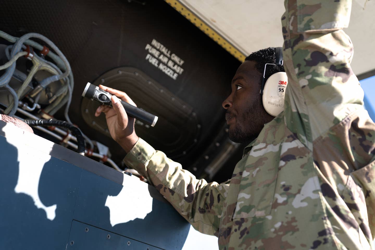 A member assigned to 319th Aircraft Maintenance Squadron Detachment 1 conducts pre-flight procedures on an RQ-4 Global Hawk Block 30 July 7, 2022, at Beale Air Force base, California. <em>Credit: Staff Sgt. Ramon A. Adelan/U.S. Air Force</em>