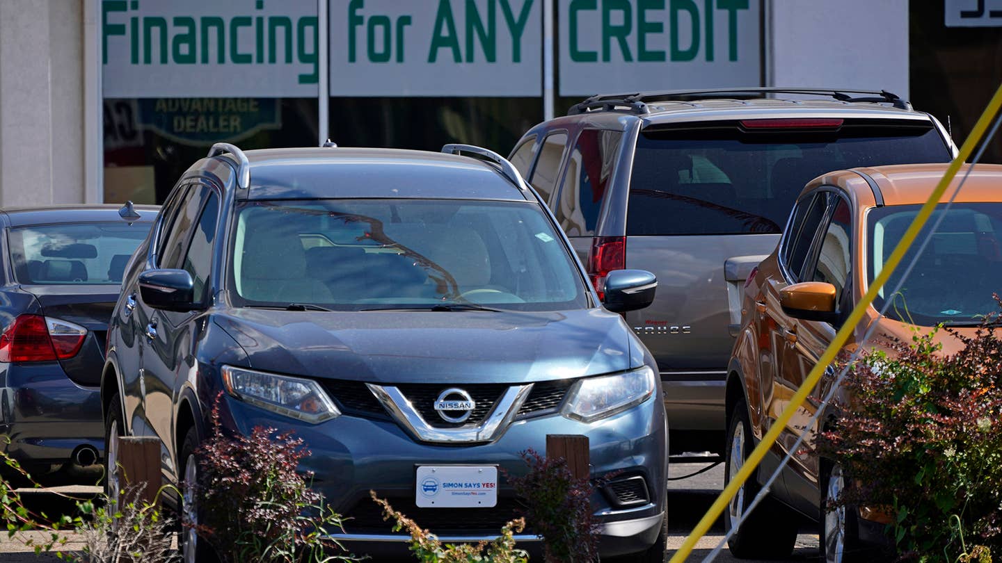 Used cars are on display in a used car lot in Akron, Ohio on July 12. (AP Photo/Gene J. Puskar)