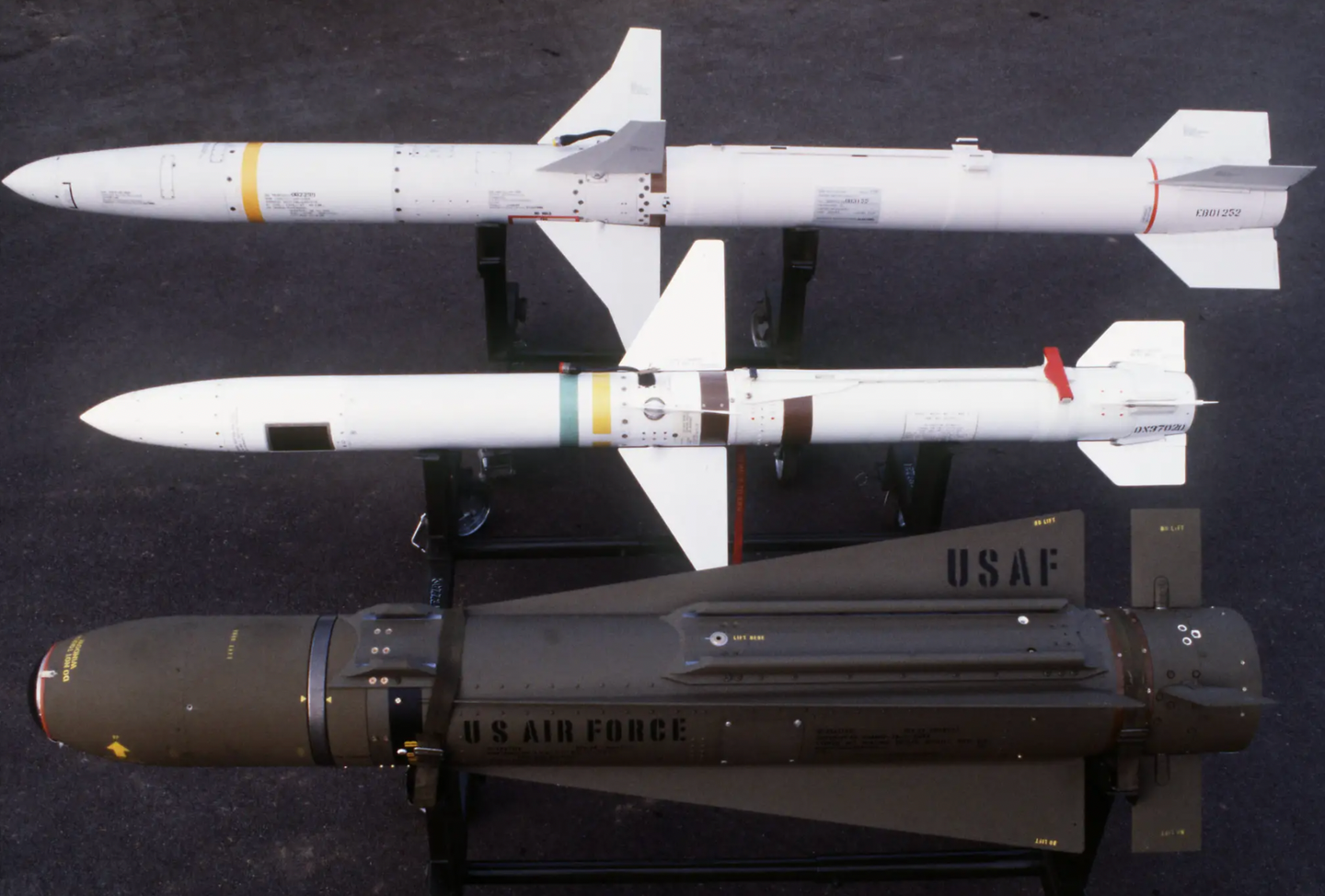 A view of, from top to bottom, an AGM-88 HARM, an AGM-45 Shrike anti-radiation missile, and an AGM-65F Maverick infrared-imaging guided missile. <em>U.S. Air Force</em>