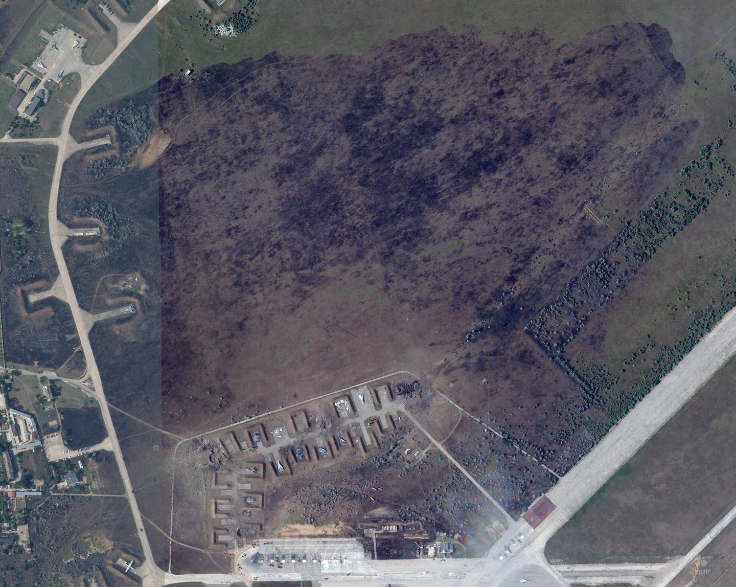 A zoomed-out look at the massive now-scorched area at Saki Air Base that shows how far the ensuing fire appears to have spread. <em>PHOTO © 2022 PLANET LABS INC. ALL RIGHTS RESERVED. REPRINTED BY PERMISSION</em>