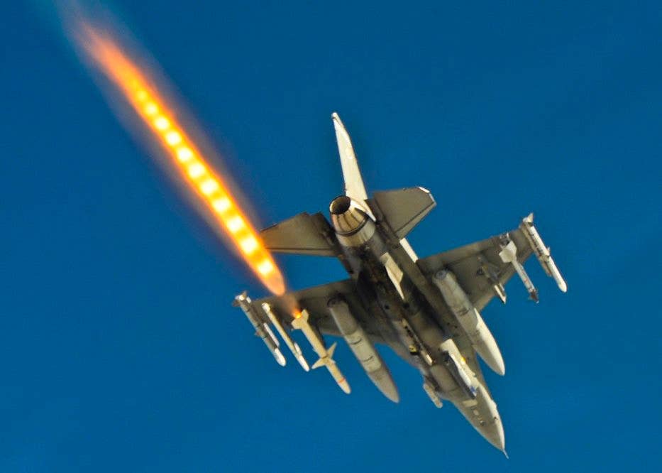 An F-16CJ Viper fighter jet fires an AGM-88 missile. <em>USAF</em>