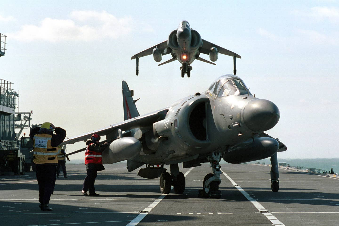 U.K. Royal Navy Sea Harrier FA2s operate from the aircraft carrier HMS <em>Ark Royal. Crown Copyright</em>