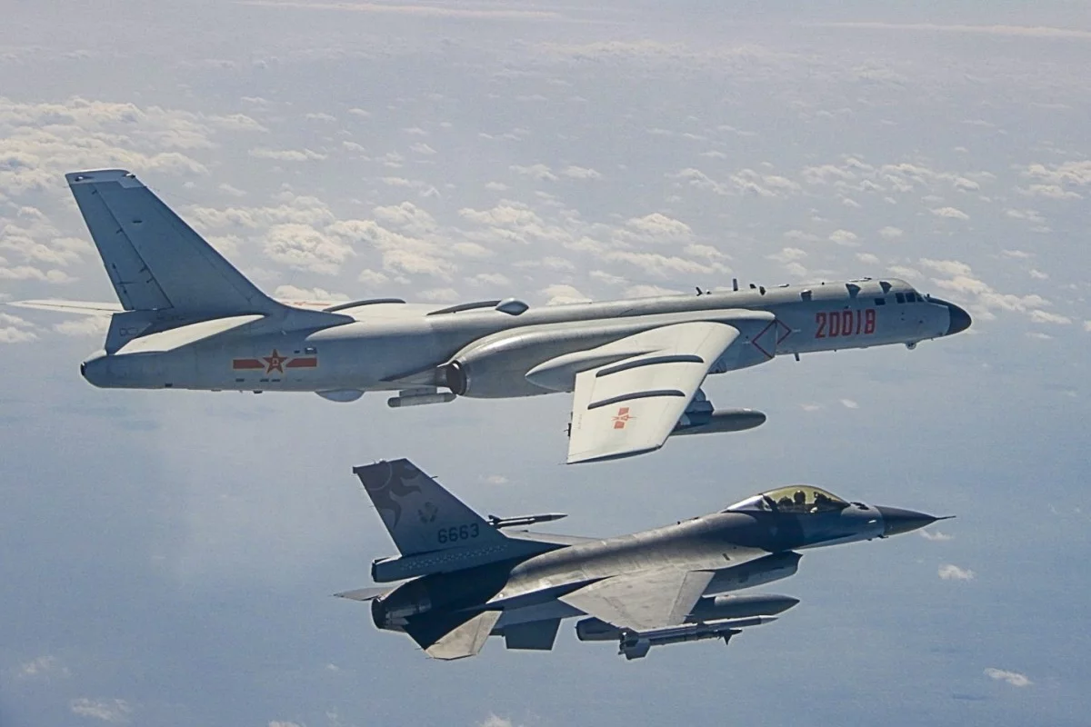 A ROC Air Force F-16 fighter jet shadows a cruise-missile-carrying PLA Air Force H-6K bomber that had approached the island of Taiwan. <em>Military News Agency, ROC</em>