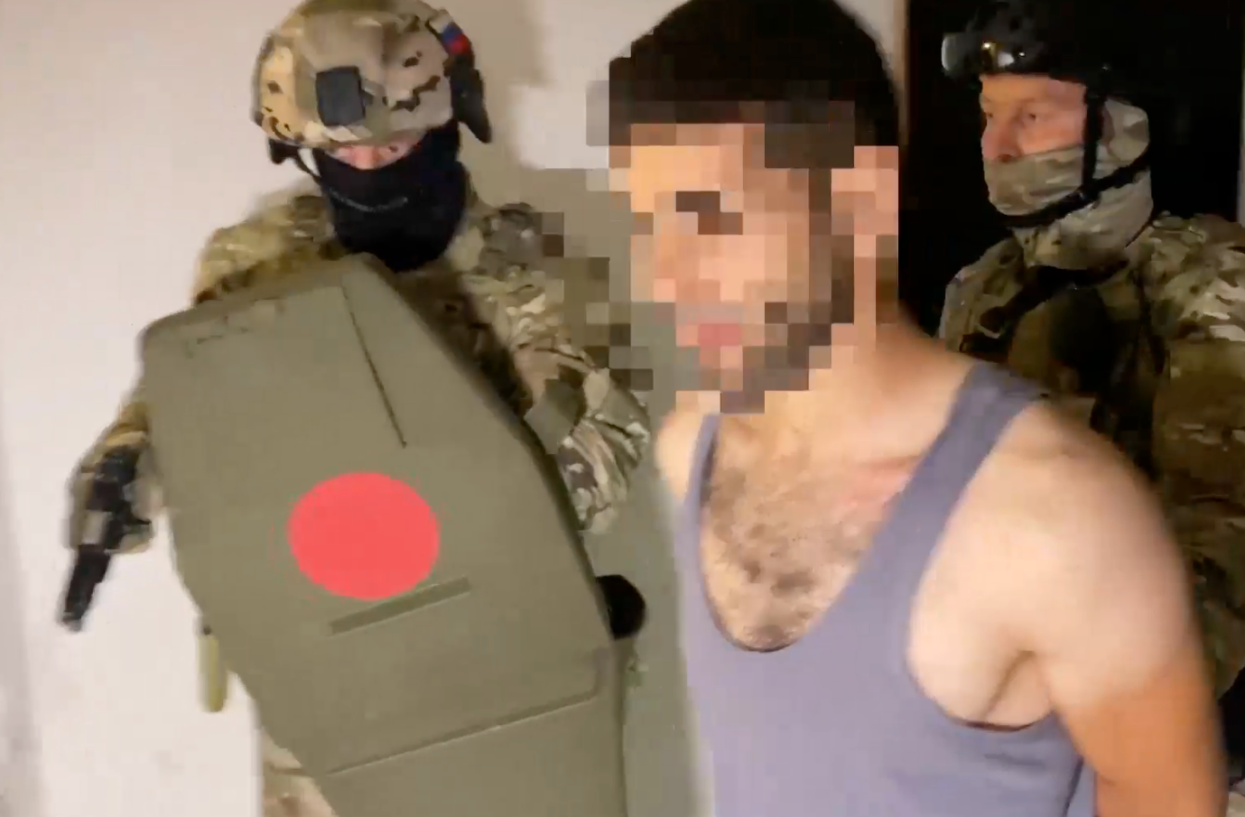 Members of the Russian FSB security service roundup purported members of an Islamic terror organization in Crimea. (Screen shot of <em>TASS</em> video)