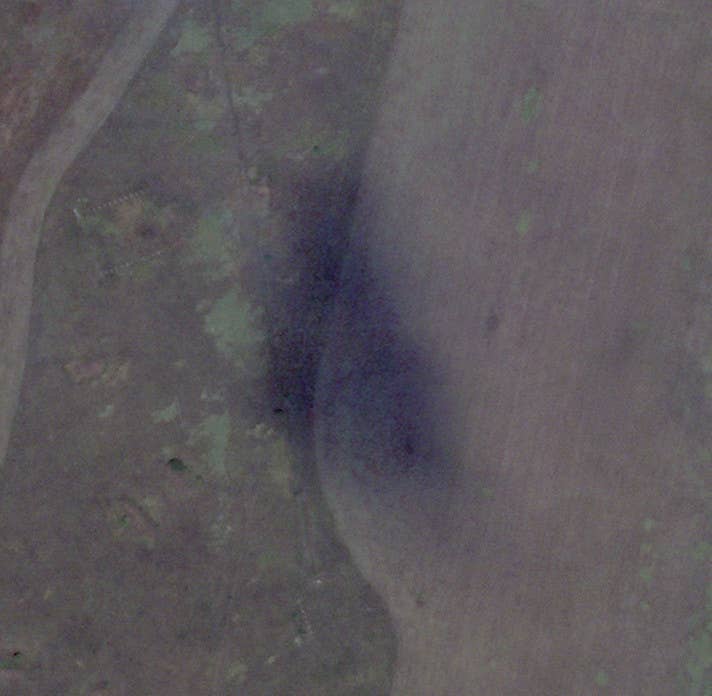 What might appear to be a burned patch of grass here is actually a shadow cast by a cloud. <em>PHOTO © 2022 PLANET LABS INC. ALL RIGHTS RESERVED. REPRINTED BY PERMISSION</em>
