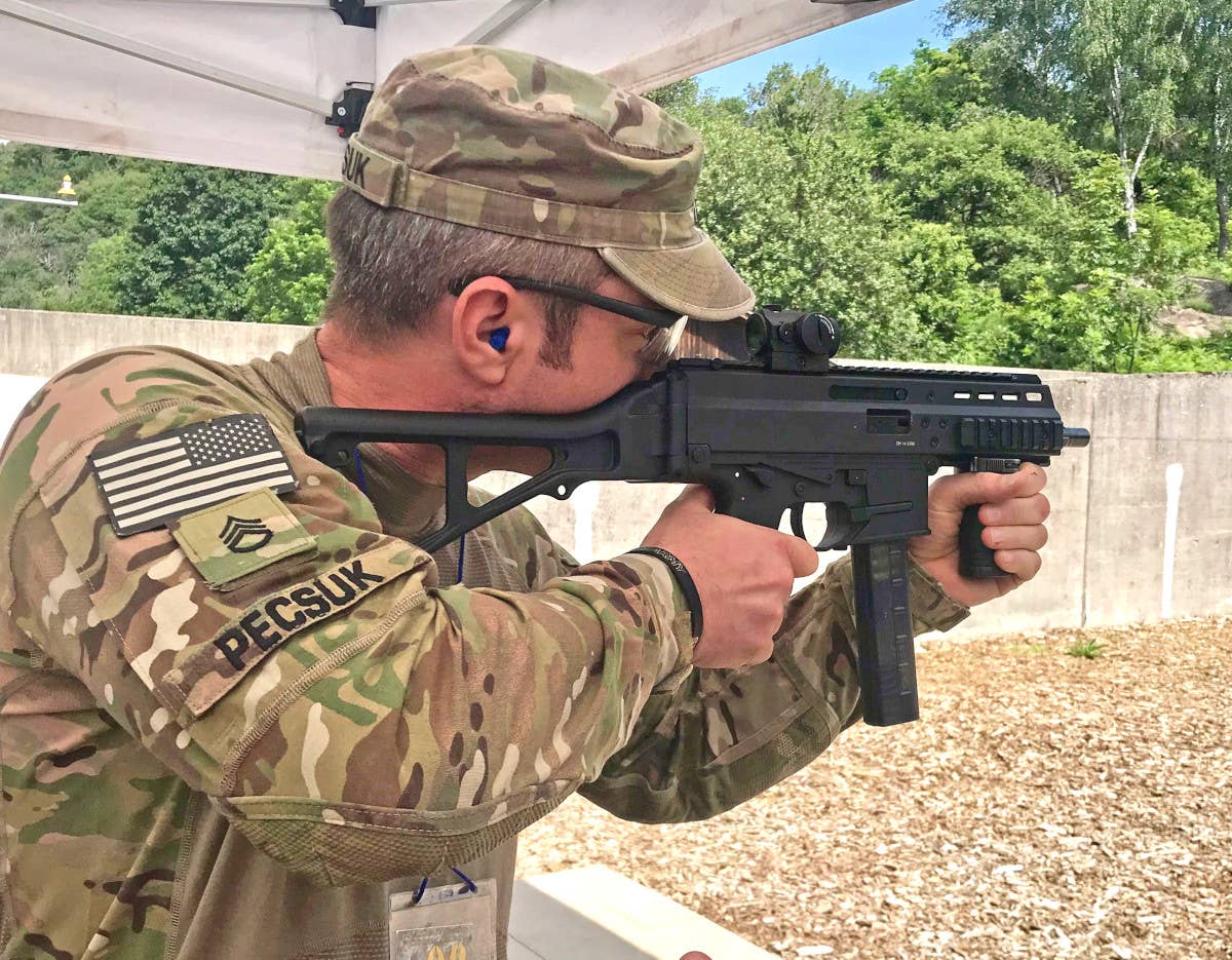 A US Army Reservist assigned to the 2500th Digital Liaison Detachment, 7th Mission Support Command, fires an APC9 PRO during an Italian Army Reserve-run competition in 2019. <em>US Army /&nbsp;Sgt. 1st Class Joy Dulen</em>