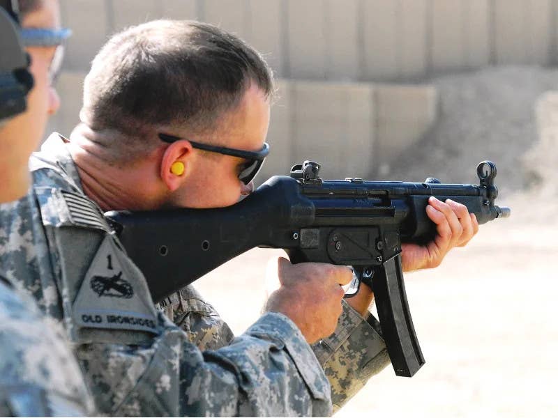 A member of the US Army fires an MP5 submachine gun. <em>US Army</em>