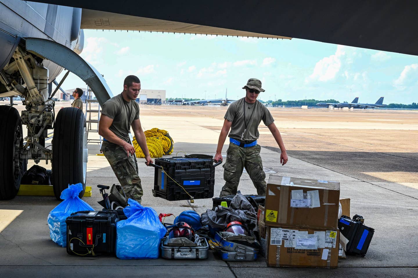 Airmen from the 2nd Aircraft Maintenance Squadron unload maintenance and support equipment from a B-52 On-board Cargo System after an Agile Combat Employment exercise at Barksdale Air Force Base. <em>Credit: Airman Nicole Ledbetter/U.S. Air Force</em>