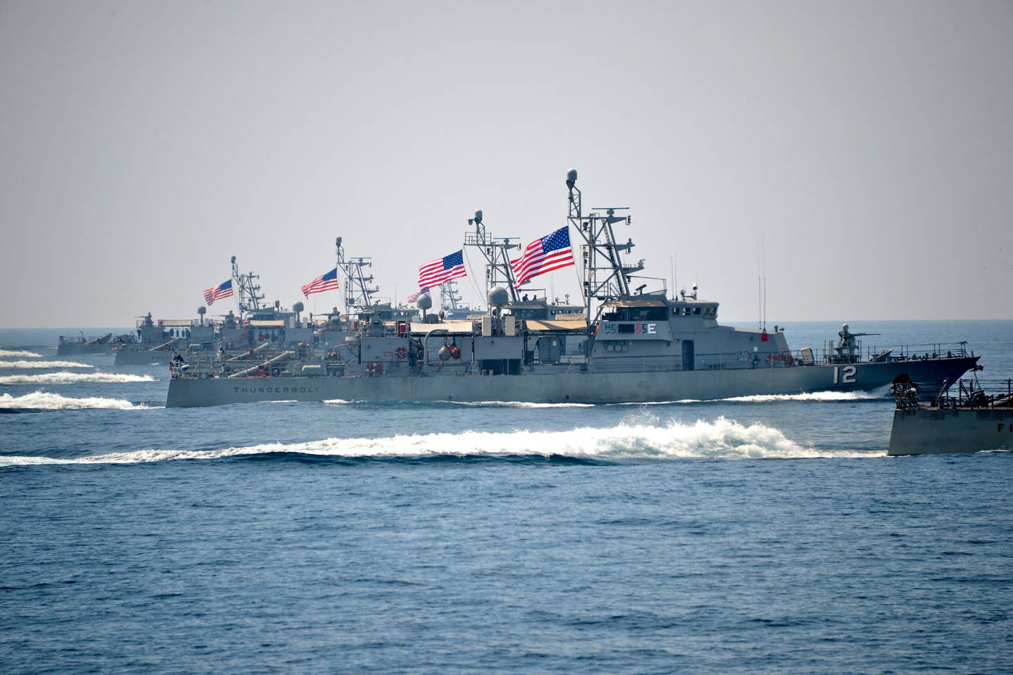The coastal patrol ship USS <em>Thunderbolt</em> (PC 12) transits alongside other PCs during a formation exercise in 2014.&nbsp;<em>Credit: Mass Communication Specialist 2nd Class Taylor M. Smith/U.S. Navy</em>