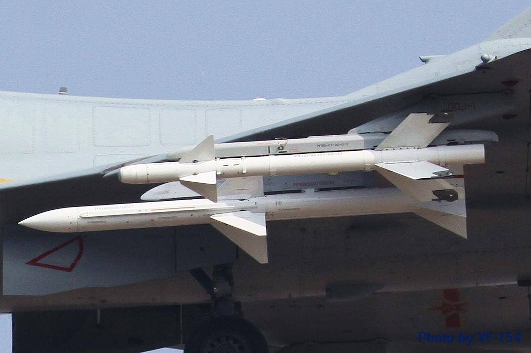 A PL-12, inboard, and PL-8, outboard, under the wing of an early J-10. <em>via ChinaDefenseForum</em>