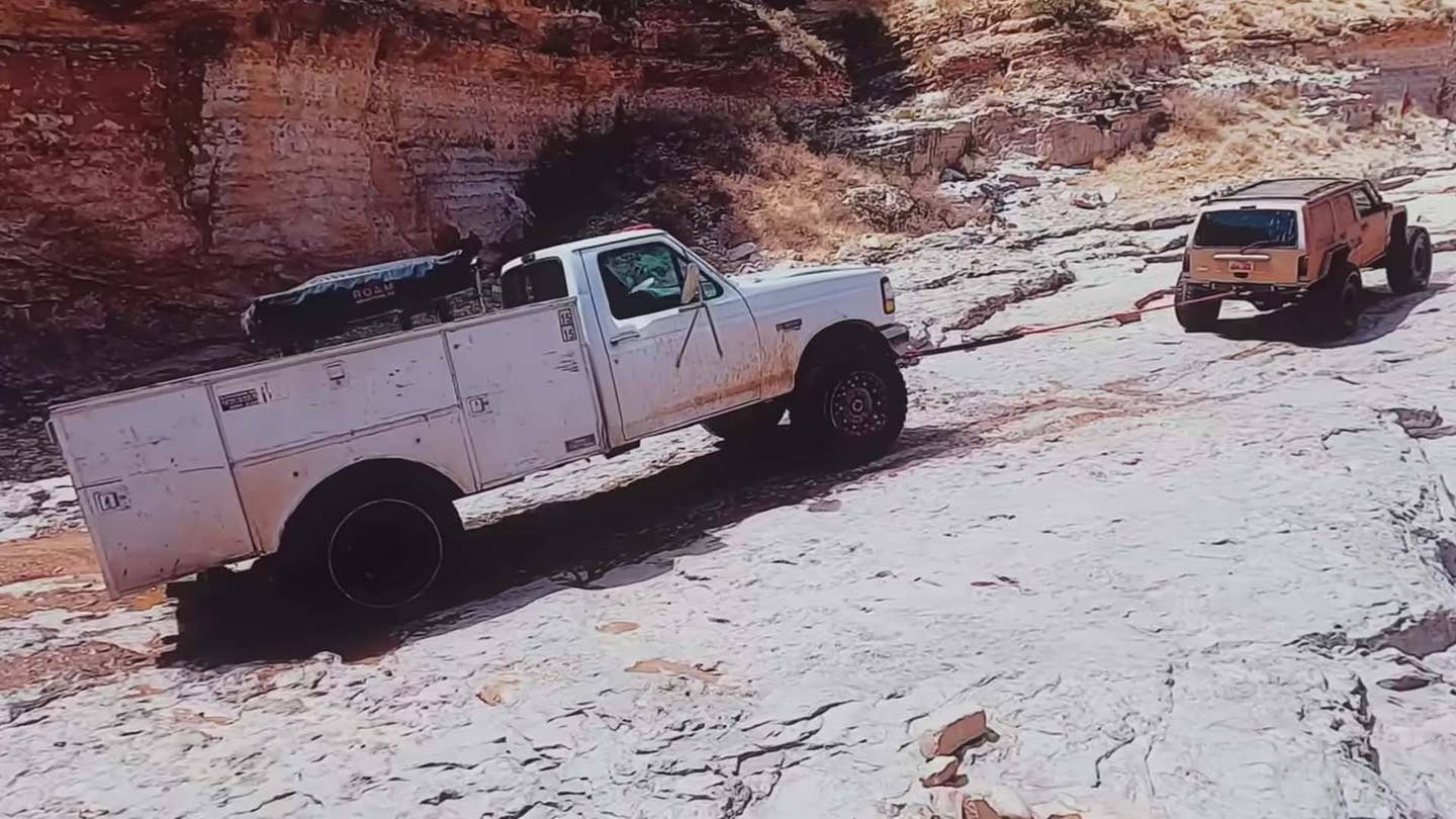Watch a Jeep Cherokee Drag a Broken Ford F-450 Out of a Gnarly Gulch