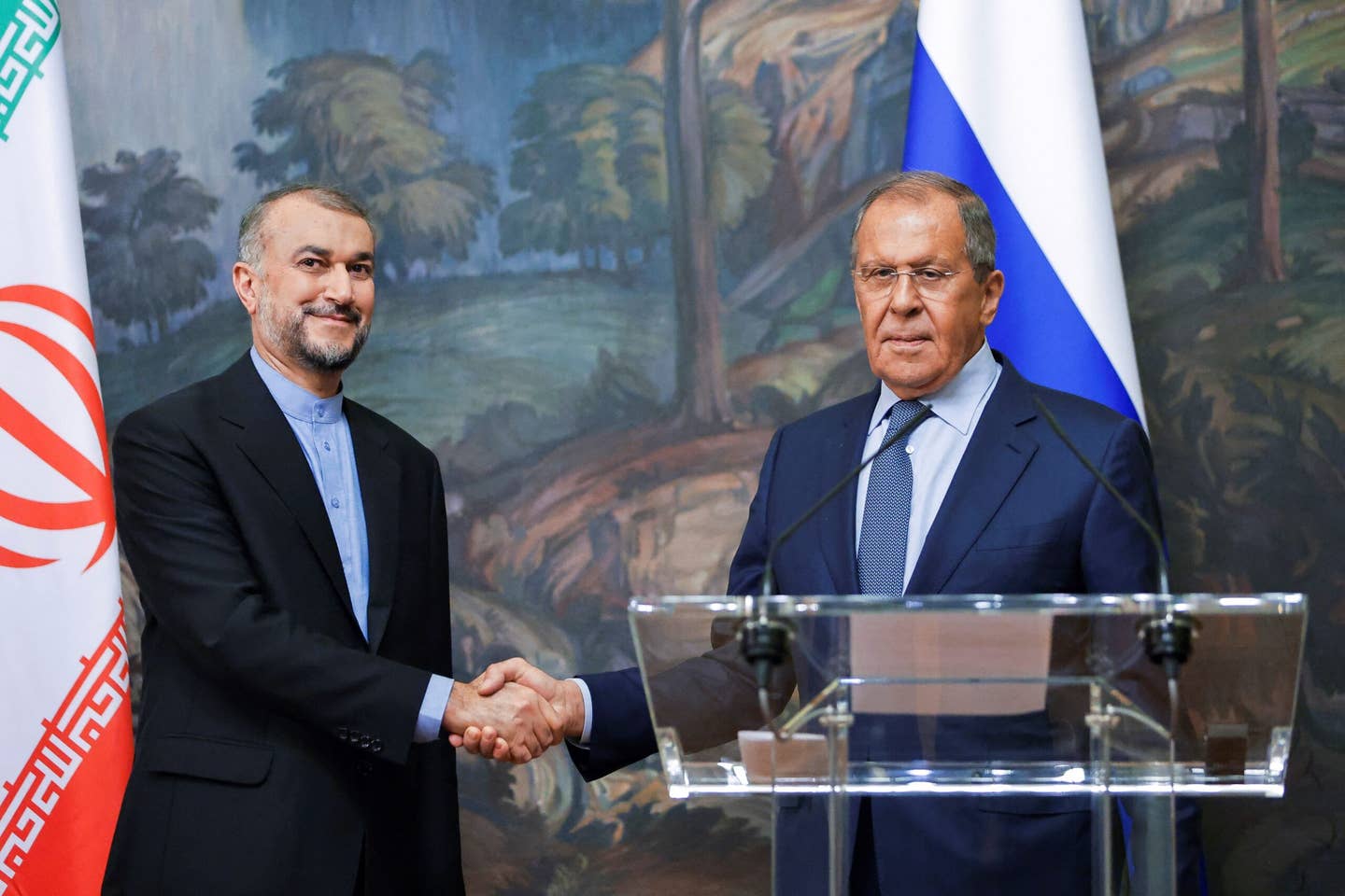 Russian Foreign Minister Sergei Lavrov (right) and Iranian Foreign Minister Hossein Amir-Abdollahian shake hands during a meeting in Moscow, on August 31, 2022. <em>Photo by MAXIM SHEMETOV/POOL/AFP via Getty Images</em>